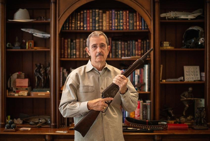 Former Land Commissioner and State Sen. Jerry Patterson holds up a Winchester Model 1895 carbine, a model favored by the ...